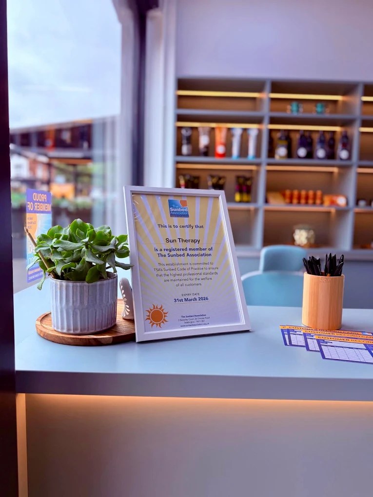 Sun Therapy's framed Sunbed Association membership certificate on the salon reception desk